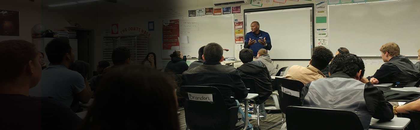Ralph Sanders teaching youth in a classroom setting